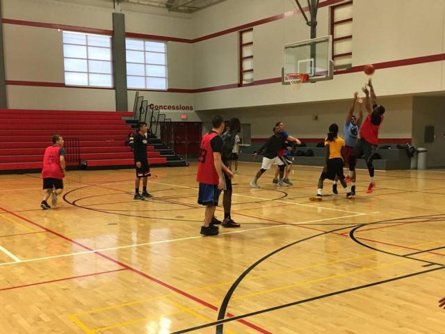 Members of Brother 2 Brother engaged in friendly competition with SIUE Police during the Unity Basketball Game.