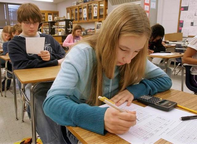 In this Monday, Oct. 7, 2012, photo, tenth grade students take a test while in class at Springfield High School in Springfield, IL.