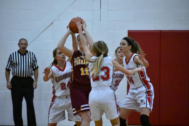 Calhoun players, led by Grace Baalman, No. 54, in the middle, swarm a Griggsville opponent defensively. (All photos by Alison Godar)