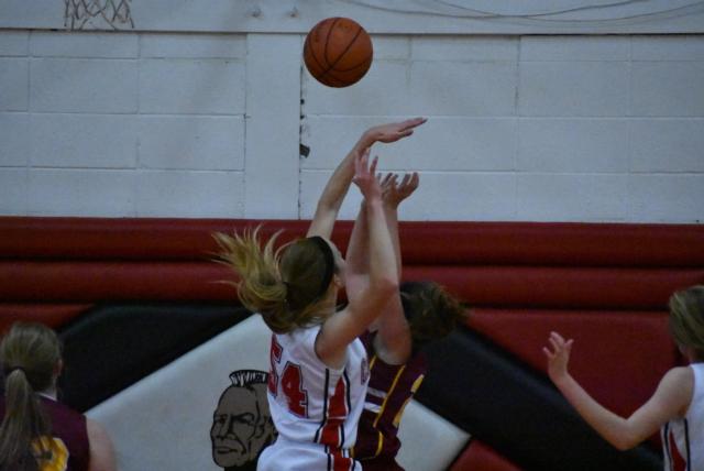 Calhoun's Grace Baalman fires a shot over a Griggsville opponent in a recent game. Grace Baalman will be the scoring leader and a dominant player throughout the area this season. (Photo by Alison Godar)