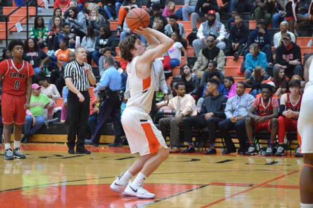 Jack Marinko releases a free throw shot Friday against Granite City. Marinko connected on 23 points against the Warriors. (Photo by Brent Feeney)