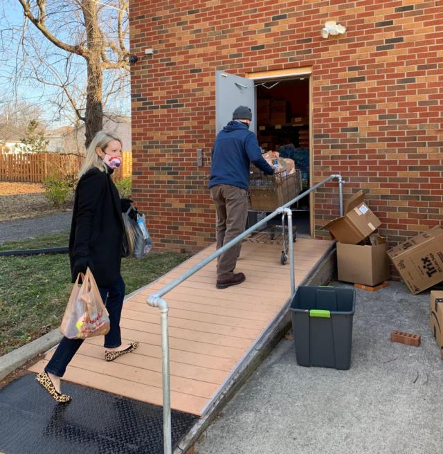 Madison County Board member Erica Conway-Harriss of Glen Carbon and Interim Facilities Director Chris Milton deliver food and non-perishable items to Glen-Ed Food Pantry Thursday morning. Madison County employees collected 2.5 tons to be donated to local food pantries this holiday season.