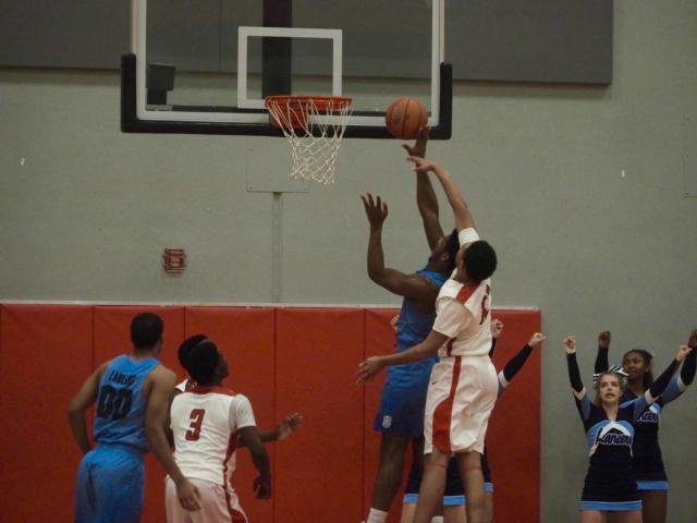 Josh Rivers blocks a layup attempt.