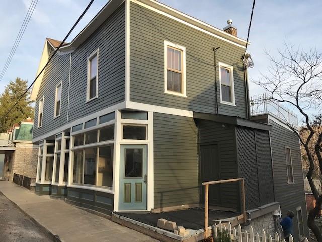 After painting but before repair of foundation and sidewalk to be partially funded by the matching grant from Landmarks Illinois.