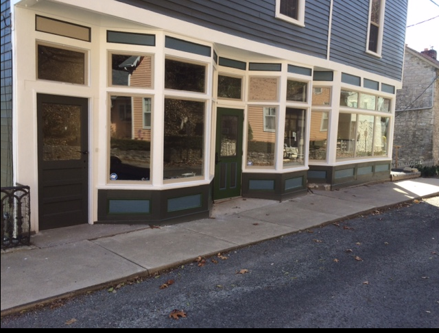 Front and sidewalk (after painting) where repair of original quarry stone foundation and replacement of sidewalk will occur, with matching funds provided by Landmarks Illinois