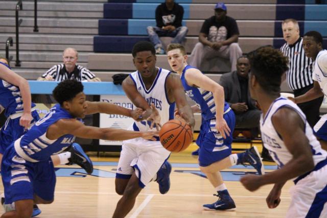 Shandon Boone goes in for the steal against Deavis Johnson. 