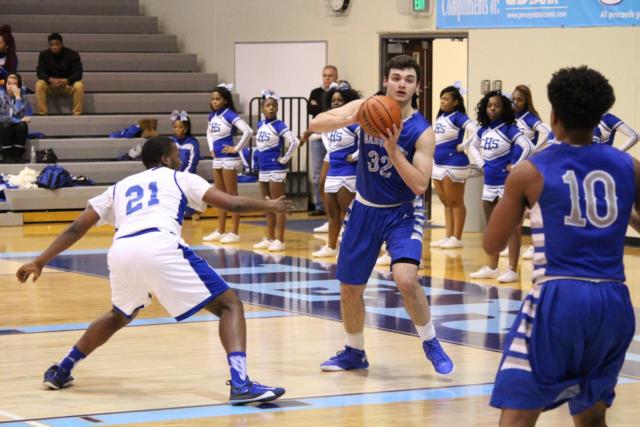 Ben Sebacher prepares to pass to Shandon Boone as Malik Johnson comes in to block. 