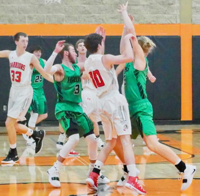 Ethan Brannan (3) and Hunter Flowers (15) double-team Calhoun's Trevor Johnson at half court in the first game in the Black Division of the 2019 Beardstown Tournament.
