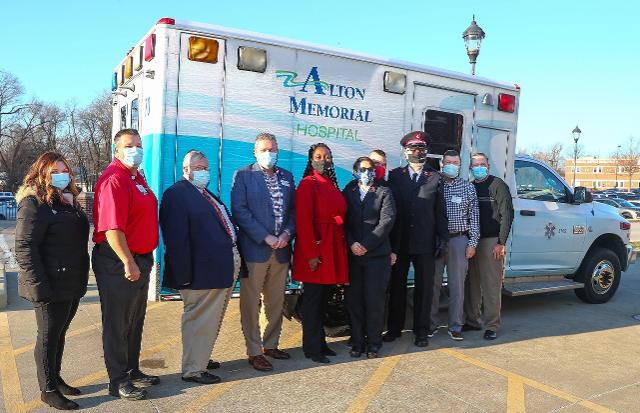 Representatives of The Salvation Army and Alton Memorial Hospital gathered outside the AMH ambulance bay on Dec. 21 as the hospital donated one of its ambulances to the Alton Corps Community Center. Left to right are Kristen Ryrie, AMH Development manager; Jason Bowman, AMH EMS manager; Kevin Botterbush of the Salvation Army Advisory Board; Brad Goacher, chief operations officer of AMH; LaKeysha Field, assistant divisional director of Social Services for The Salvation Army Midland Division; Capt. Cassy Grey and Capt. Sean Grey of the Alton Corps Community Center; Maj. Kjell Steinsland, general secretary and St. Louis regional commander of The Salvation Army’s Midland divisional headquarters; Dave Braasch, AMH president; and Rusty Ingram, director of Business Development at AMH.