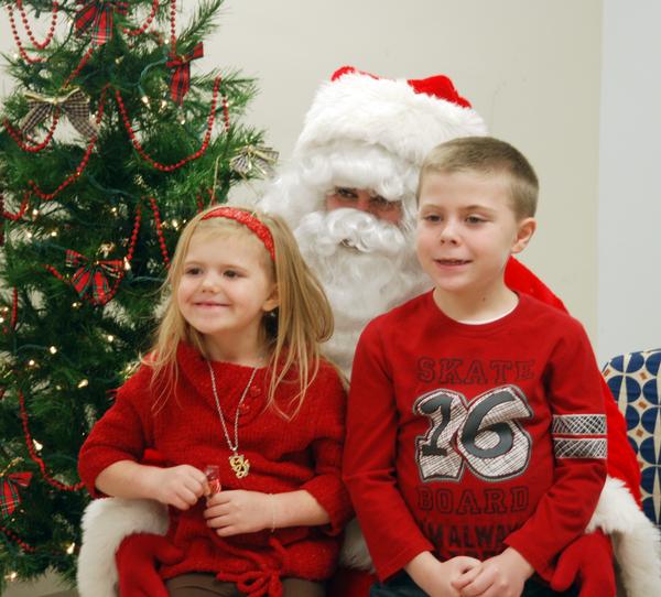 Madyson Henkhaus, and her brother, Will, enjoy some time on Santa's lap Madyson Henkhaus, and her brother, Will, enjoy some time on Santa's lap