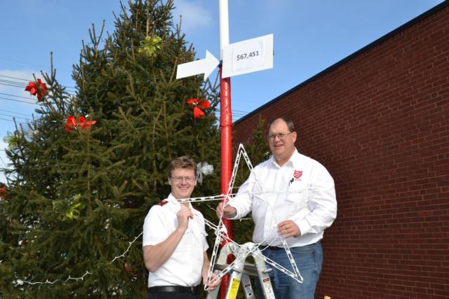 Lt. Bryan Ellison and Greg Gelzinnis are both hopeful of making the goal of $99,000.