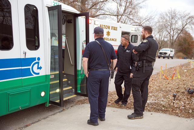 MCT supervisor, AFD Captain Davison and APD officer look inside the bus.