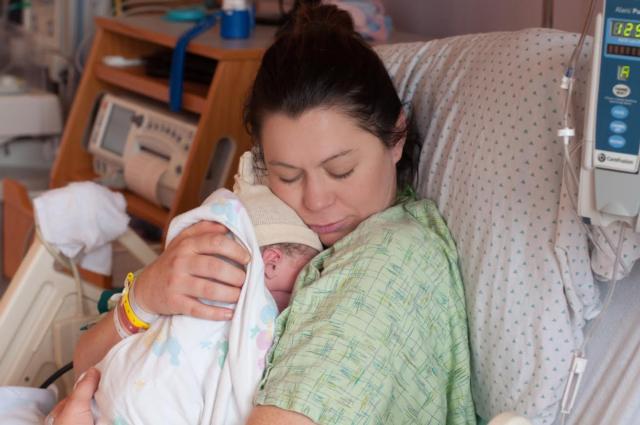 Mom Savannah Rheude bonds with her new baby Ella June at the Women's Pavilion at OSF Saint Anthony's Health Center.