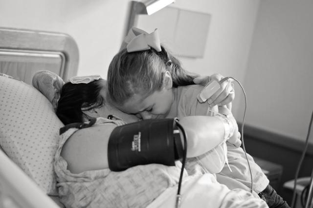 After the caesarean section, it was an emotional reunion for Savannah Rheude and her five year old daughter Maylin at the Women's Pavilion at OSF Saint Anthony's Health Center.