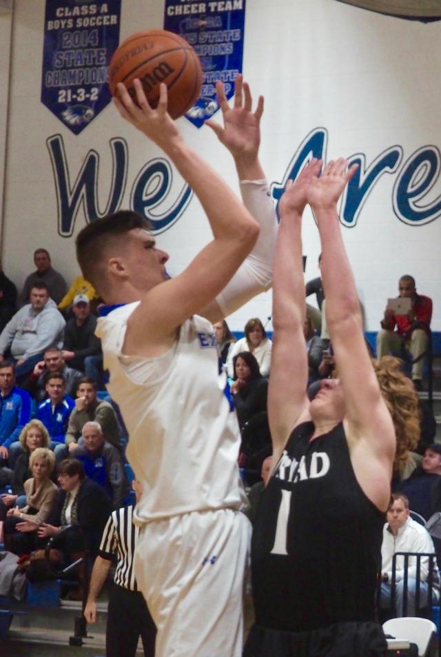 Jake Hall (25) shoots a hook-shot over Beau Barbour. 
