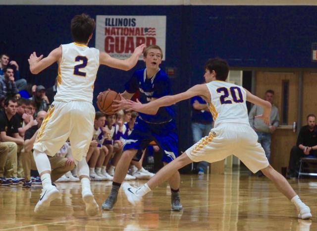 Sammy Green getting double-teamed at mid-court by Clark (2) and Will Buhs (20).