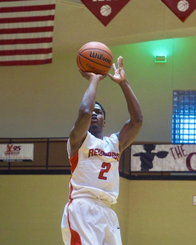 Kevin Caldwell shoots a mid-range shot.