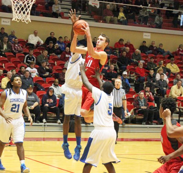 Bryan Hudson drives the lane in the Centralia Tourney for Alton.