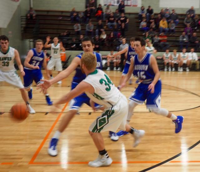 Cole Brannan passes to the inside for the Hawks against Auburn. (Photo by John Hough)