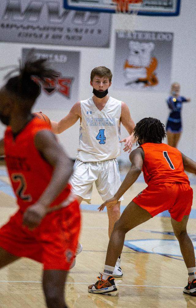 Edward Roberts (No. 4) led the Panthers with 19 points in an OT win over Edwardsville in the Jersey Mid Winter Classic on Friday night. (Photo by Randy Manning)
