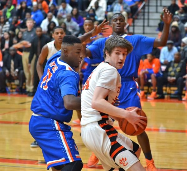 Oliver Stephen drives the basket in a recent Edwardsville game. Stephen had nine points in Edwardsville's Salem Tourney title win on Saturday.