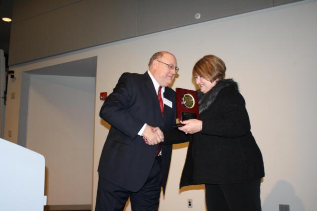 Outgoing RBGA Board Chairman Karen2016 RBGA Board Chair Karen Wilson accepts her gift from Augie Wuellner. 