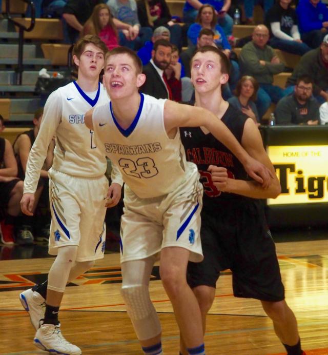 Jonah Hopper and Corey Nelson battle for a rebound.