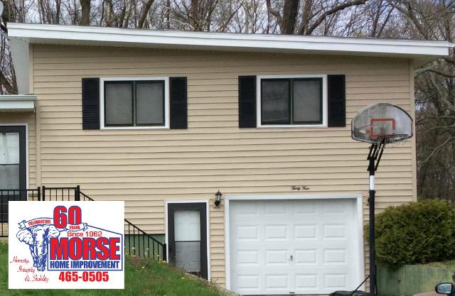 AFTER: Morse Home Improvement removed and replaced all of the old roofing, aluminum siding, shutters, front storm door and garage door on this project.