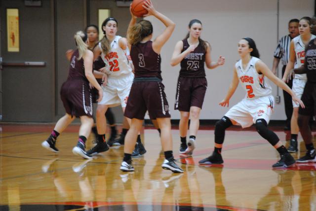The Tigers continue to be strong on defense against Belleville West. (Photo by Brent Feeney)