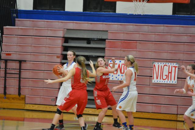Roxana fought hard through the entire game against Vandalia under the basket for boards. (Photo by Dan Brannan)