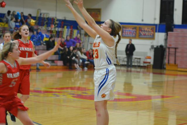 Roxana's Abby Palen lets a shot go from the corner. (Photo by Dan Brannan)