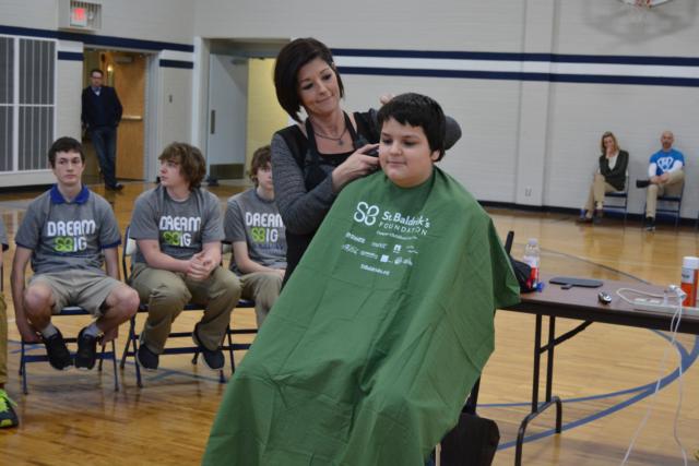 JC Carlisle donates his hair for cancer research. He is a St. Mary's seventh-grader.