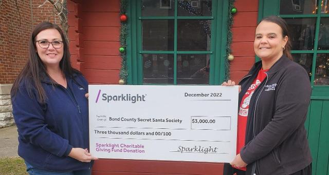 Sparklight Customer Service Manager Ashley O’Dell (left) recently presented a $3,000 grant to Kellee Suzuki, Secretary of the Bond County Community Foundation for the organization’s Secret Santa Society. The donation was part of Sparklight’s biannual Charitable Giving Fund donation and will support the Foundation’s Bring the Joy Campaign in which they meet the needs of local families in the form of Christmas gifts, clothing, food, and paying outstanding lunch accounts.