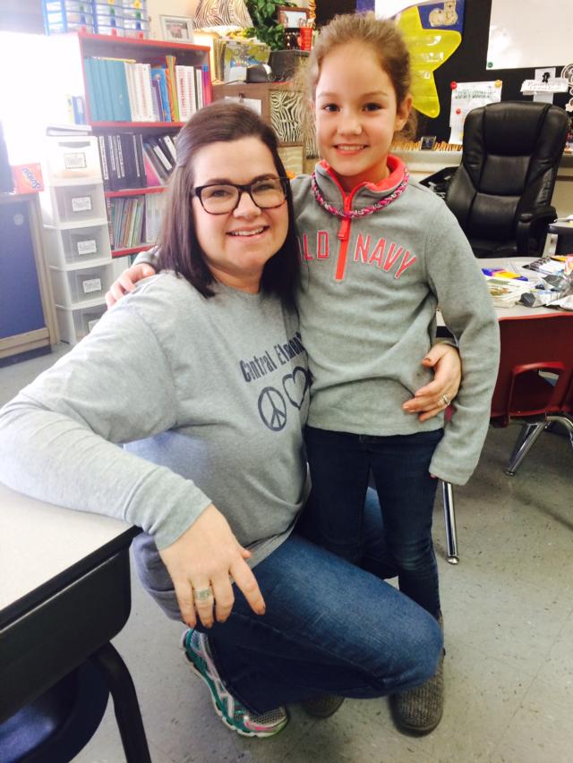 Reagan Lynn, 8, stands in her classroom with her teacher, Mrs. Gates, at Central Elementary School