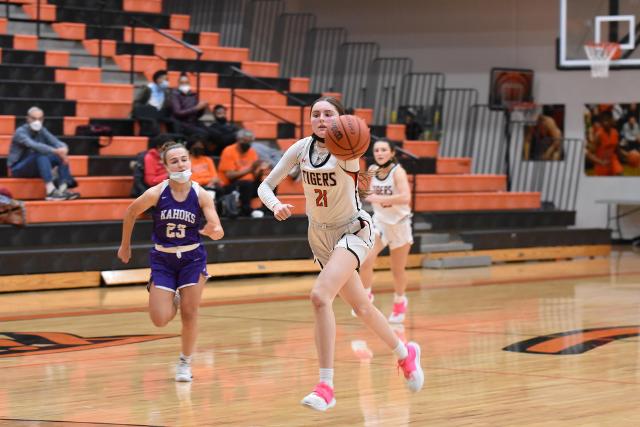 Ele Evans rushes for a basket for the Tigers against the Kahoks. She had 12 points for Edwardsville. (Photo by Dan Brannan)