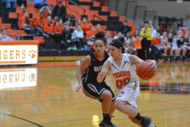 Jasmine Bishop (00) moves the ball to the basket for Edwardsville against Granite City on Tuesday night. (Photo by Dan Brannan)
