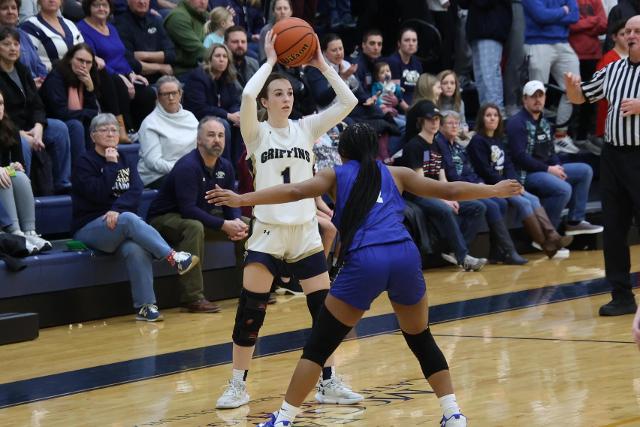 Mary Harkins looks for an open teammate against Marquette Catholic back on Feb. 1.