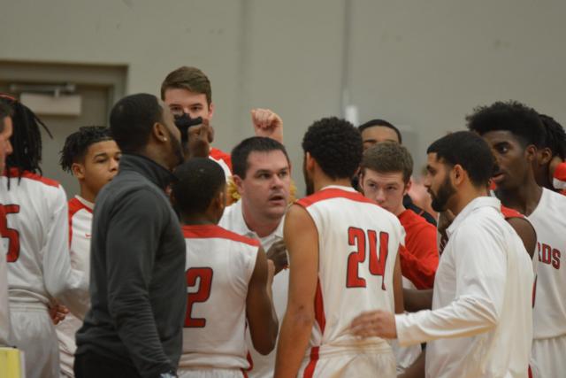 Alton head coach works to inspire his boys in a timeout on Friday night at Alton. (Photos by Dan Brannan)