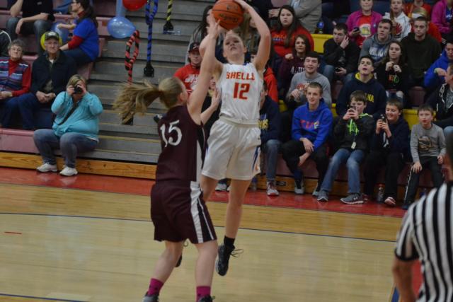Maddy Sheraka is fouled before making the free throw that put her on top of the Roxana girls scoring list.