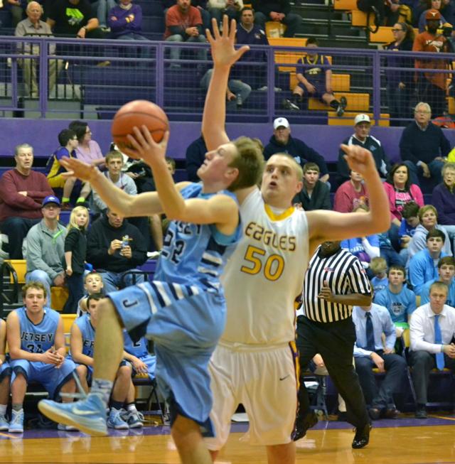 Jersey's Zac Ridenhour slides in for two of his 24 points Friday night against Civic Memorial.