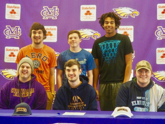 Brayden Pierce (center) and Travis Wallace (lower right) signed their letters of intent on Wednesday afternoon at Civic Memorial High School.