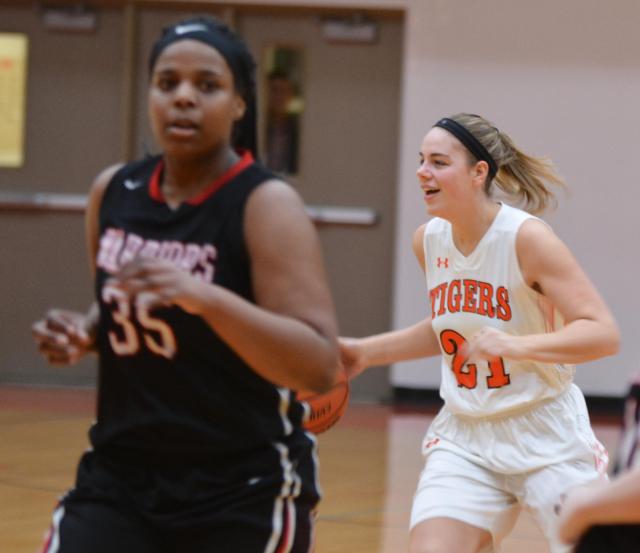 The Tigers' Rachel Pranger displays a big smile on her face during Senior Night against O'Fallon. She led her team with 22 points in one of her better games of the season. (Photos by Dan Brannan)
