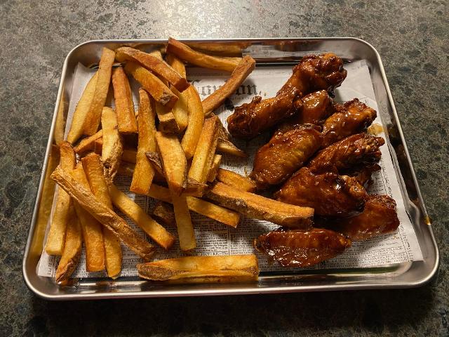 Wings and hand-cut fries are popular items on the menu.