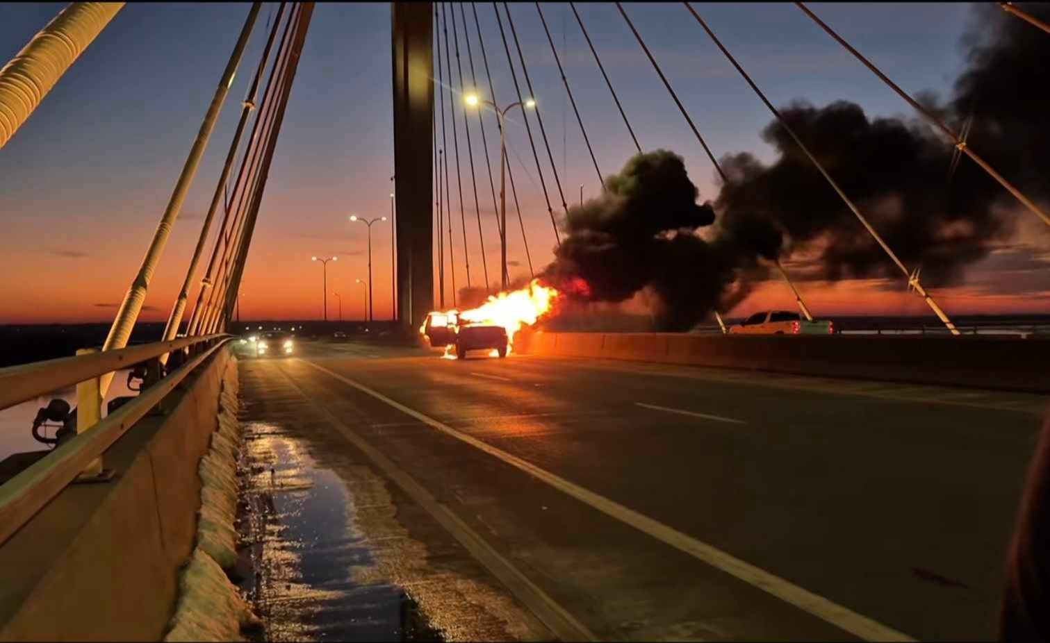 The vehicle on Clark Bridge was fully engulfed in fire when firefighters arrived.. (Photo courtesy of Lena Monet Blasioli and the Downstate Illinois/Metro-East St. Louis Scanner 911).
