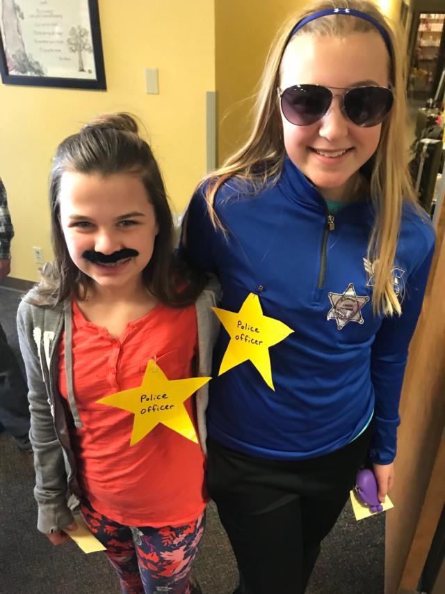 Sixth graders, Grace Deakos and Maggie Pifer, working the “Jail” Booth at Mission Carnival.
