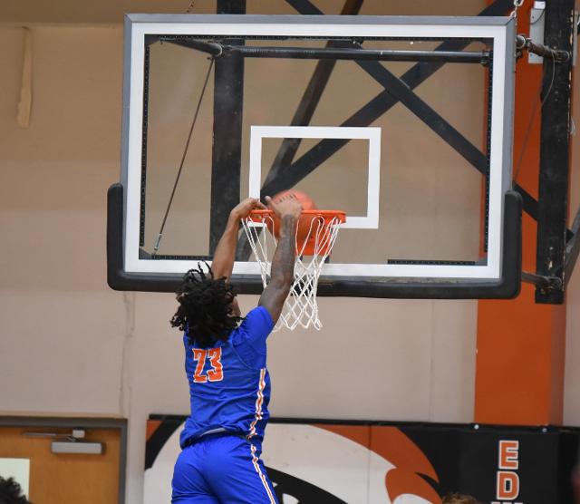 The Flyers' Macaleab Rich goes in slam dunk against the Tigers on Friday night. (Photo by Dan Brannan)