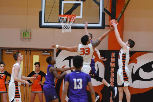 A.J. Epenesa and Oliver Stephan battle for a rebound on Tuesday night against Collinsville. (Photo by Dan Brannan)