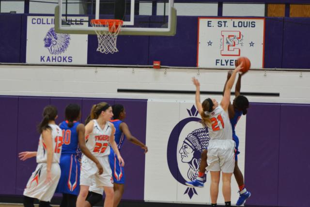 Edwardsville's Rachel Pranger blocks a shot against East St. Louis. (Photo by Dan Brannan)