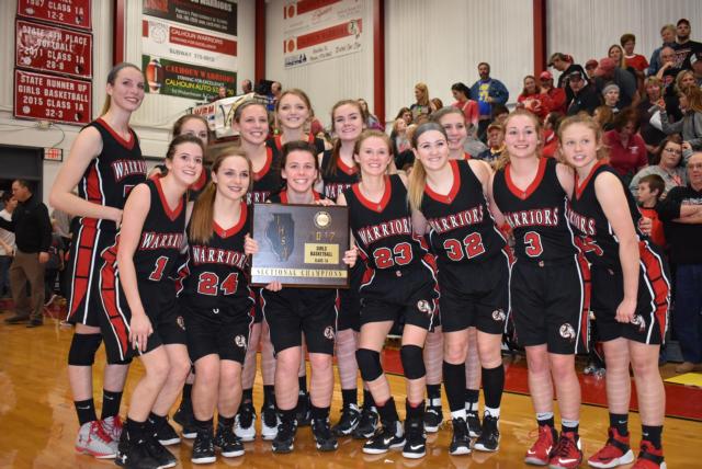 Calhoun's girls basketball team stands with its sectional championship plaque Tuesday. (Photo by Alison Godar)