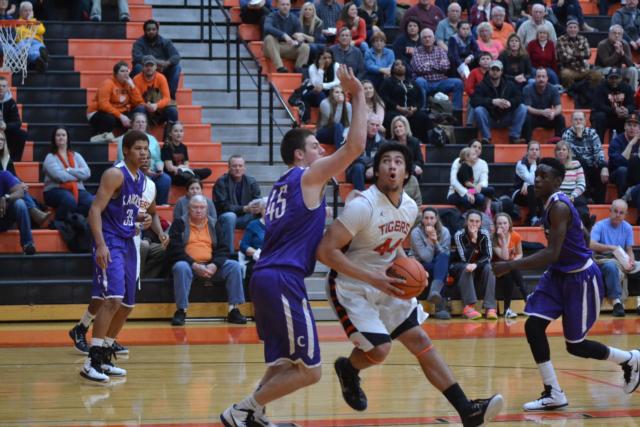 A.J. Epenesa drives to the basket for one of his 10 points against Collinsville on Tuesday night.
